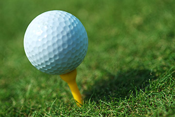 A golf ball on a tee